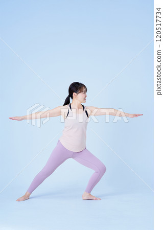 A woman who poses yoga 120517734