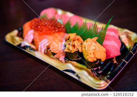 uni sushi with maguro sushi and salmon sushi set on desk, japanese food 120518152