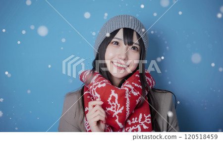 woman smiling in the snow 120518459
