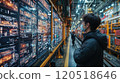 Young engineer analyzing data displays in a modern industrial facility during the day. Generative AI 120518646