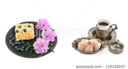 Meringue cake with blueberries, Turkish delight and a cup of coffee isolated on white. Free space for text. Collage. Wide photo. Meringue cake with blueberries, Turkish delight and a cup of coffee isolated on white. Free space for text. Collage. Wide photo. 120520547