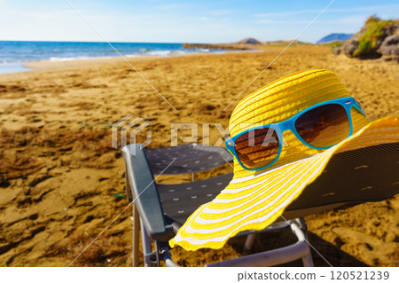 Summer hat and sunglasses on beach Summer hat and sunglasses on beach 120521239