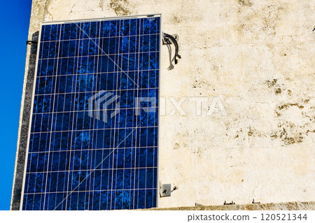 House wall with solar photovoltaic panel House wall with solar photovoltaic panel 120521344