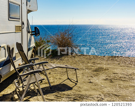 Rv camper camping on sea shore, Spain. Rv camper camping on sea shore, Spain. 120521393