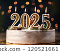 A joyful and exciting moment with a 2025 New Year celebration cake, with the candles shaped like the number 2025 lit up 120521661