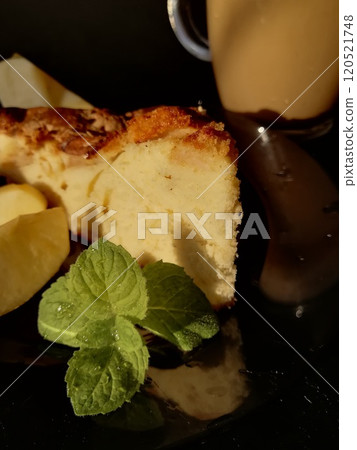Сup of coffee tea on the table with a homemade cake decorated with a fresh mint 120521748