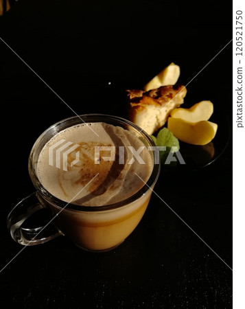 Сup of coffee tea on the table with a homemade cake decorated with a fresh mint 120521750