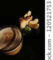 Сup of coffee tea on the table with a homemade cake decorated with a fresh mint 120521753