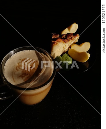 Сup of coffee tea on the table with a homemade cake decorated with a fresh mint Сup of coffee tea on the table with a homemade cake decorated with a fresh mint 120521755