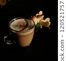 Сup of coffee tea on the table with a homemade cake decorated with a fresh mint 120521757