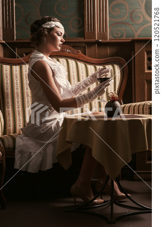 Beautiful blond woman drinking red wine.make-up.red lips.wineglass Beautiful blond woman drinking red wine.make-up.red lips.wineglass 120521768