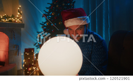 Boy Makes Christmas Magic Games Near The Tree And Fireplace At Night With Ball Boy Makes Christmas Magic Games Near The Tree And Fireplace At Night With Ball 120521901