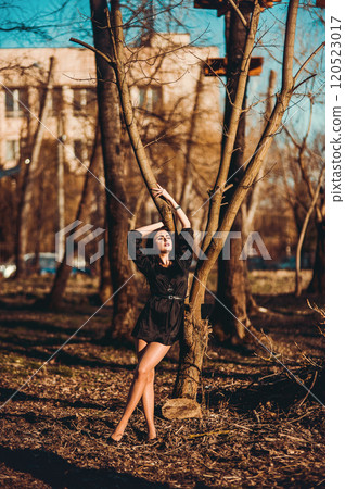 High Fashion model woman in colorful bright lights posing in the street. 120523017