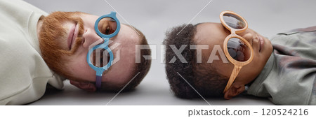 Header image of little Black boy typing on laptop keyboard writing homework task or playing video game while sitting at desk in bedroom, copy space 120524216