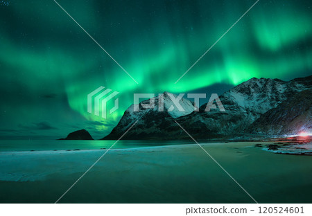 Aurora borealis on night sky over snowy mountains and sandy beach Aurora borealis on night sky over snowy mountains and sandy beach 120524601