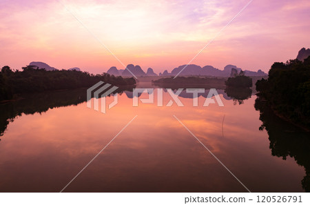 Majestic sunset clouds sky over lake landscape,Amazing colorful light of nature cloudscape sunset or sunrise sky background Majestic sunset clouds sky over lake landscape,Amazing colorful light of nature cloudscape sunset or sunrise sky background 120526791