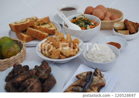 traditional Indonesian food arranged neatly on a white surface traditional Indonesian food arranged neatly on a white surface 120528697