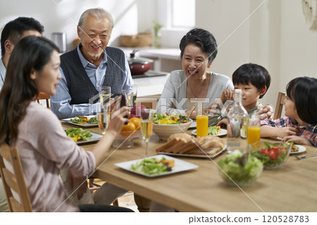 multi generational asian family eating meal at home multi generational asian family eating meal at home 120528783