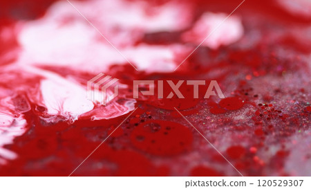 Ink splash. Glitter liquid flow. Defocused white red color shiny sequin particles acrylic paint drops emulsion gel fluid mix abstract art background. Ink splash. Glitter liquid flow. Defocused white red color shiny sequin particles acrylic paint drops emulsion gel fluid mix abstract art background. 120529307