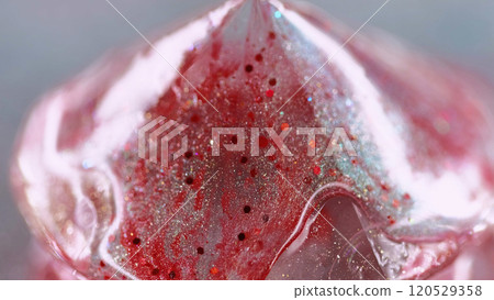 Sparkling fluid spill. Liquid shimmer texture. Blur red color shiny glitter particles paint gloss drip diamond shape abstract art background with bokeh lights. Sparkling fluid spill. Liquid shimmer texture. Blur red color shiny glitter particles paint gloss drip diamond shape abstract art background with bokeh lights. 120529358