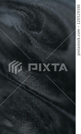 Sand texture. Gleaming particles water. Gel flows. White black silver color sparkling flakes texture paint fluid abstract art background. 120529386