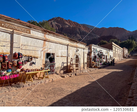 Purmamarca's streetscape with colourful handicraft markets. Purmamarca's streetscape with colourful handicraft markets. 120530681