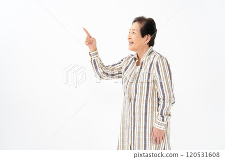 Senior woman portrait pointing 120531608