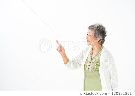 Senior woman portrait pointing 120531891