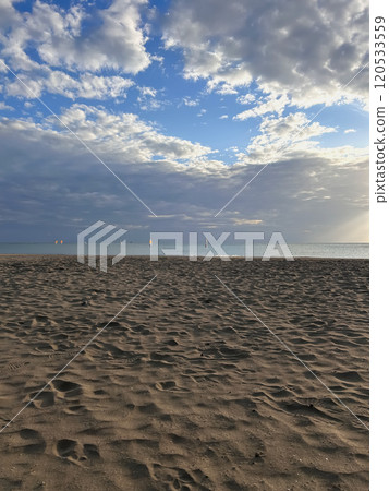 Autumn sandy beach and sea as the sun sets Autumn sandy beach and sea as the sun sets 120533559
