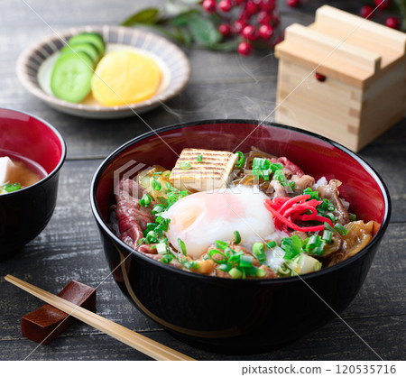 Sukiyaki rice bowl topped with soft-boiled egg 120535716