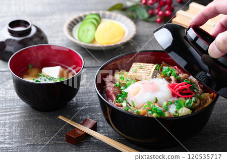 Sukiyaki rice bowl topped with soft-boiled egg Sukiyaki rice bowl topped with soft-boiled egg 120535717