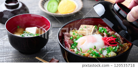 Sukiyaki rice bowl topped with soft-boiled egg Sukiyaki rice bowl topped with soft-boiled egg 120535718