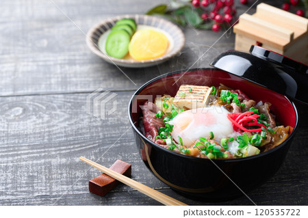 Sukiyaki rice bowl topped with soft-boiled egg 120535722