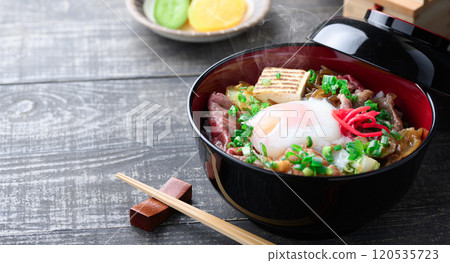 Sukiyaki rice bowl topped with soft-boiled egg Sukiyaki rice bowl topped with soft-boiled egg 120535723