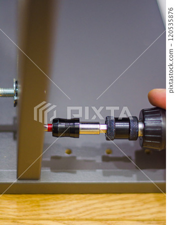 Assembling furniture with a screwdriver close-up. High quality photo 120535876