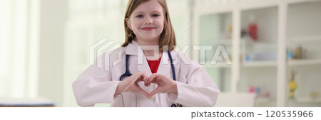 Little girl imitates role of doctor showing heart sign 120535966