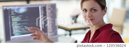 Woman shows with pen on complex code developing software Woman shows with pen on complex code developing software 120536024