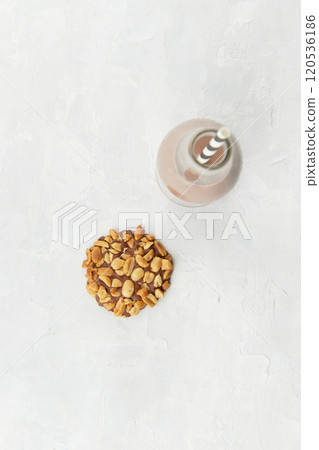 Top view of Portugues traditional penut cookie known as Bolachas de Amendoim with a bottle of milk 120536186