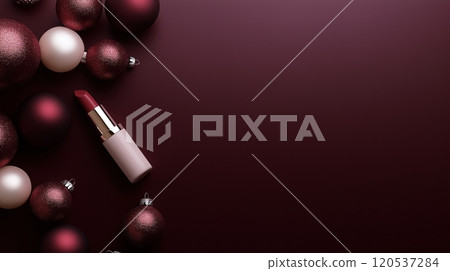 Minimalist design of red lipstick placed beside matte and glossy ornaments on a burgundy backdrop 120537284