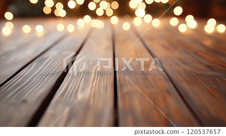 Rustic wooden planks with detailed grain, illuminated by glowing festive lights in a soft bokeh blur 120537657
