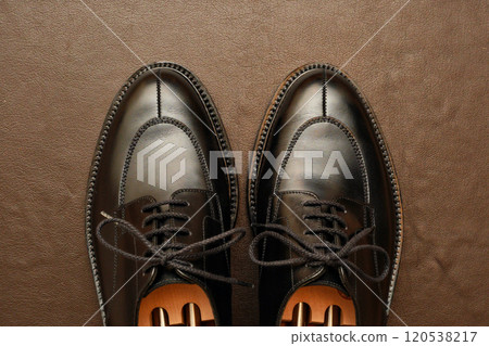 Beautifully polished black leather shoes Beautifully polished black leather shoes 120538217