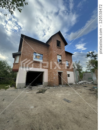 Abandoned Brick House Under a Cloudy Sky 120538472