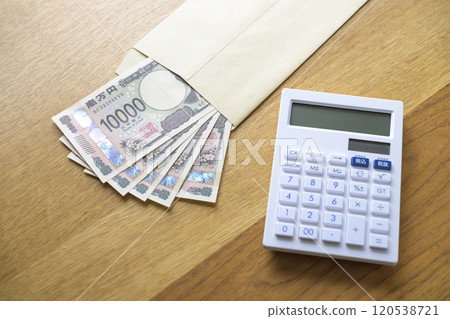 Banknotes and a calculator in an envelope (new banknotes) 120538721