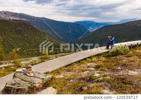 Woman on Vedahaugane rest stop, Norway Woman on Vedahaugane rest stop, Norway 120539717