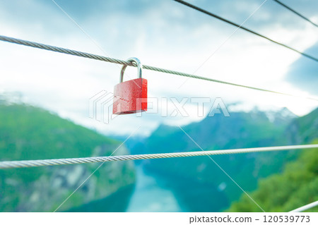 Red padlock and Geirangerfjord from Flydasjuvet viewpoint Norway 120539773