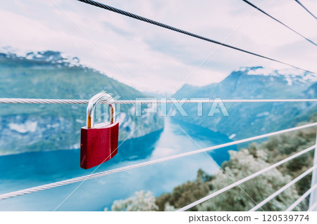 Red padlock and Geirangerfjord from Flydasjuvet viewpoint Norway 120539774