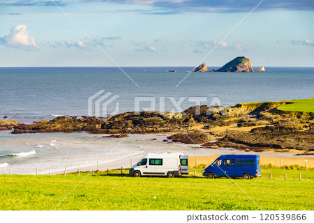 Camper vans on Verdicio beach, Asturias coast in Spain. Camper vans on Verdicio beach, Asturias coast in Spain. 120539866