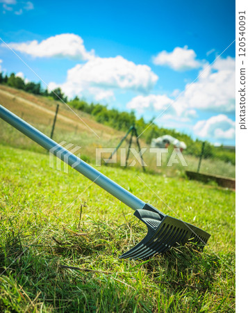 Person raking leaves Person raking leaves 120540091