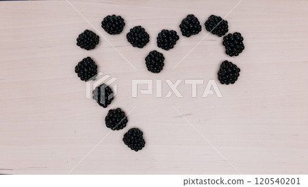 Fresh berries of blackberry in form heart 120540201