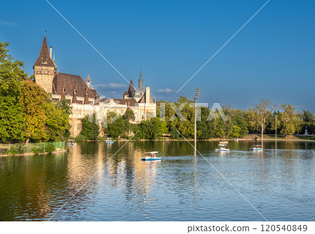 Budapest, Hungary. August 27, 2022. Shot of the City Park Ice Rink and Boating, the body of water is navigated by tour boats in the summer. Beautiful summer day. Travel destinations. Budapest, Hungary. August 27, 2022. Shot of the City Park Ice Rink and Boating, the body of water is navigated by tour boats in the summer. Beautiful summer day. Travel destinations. 120540849